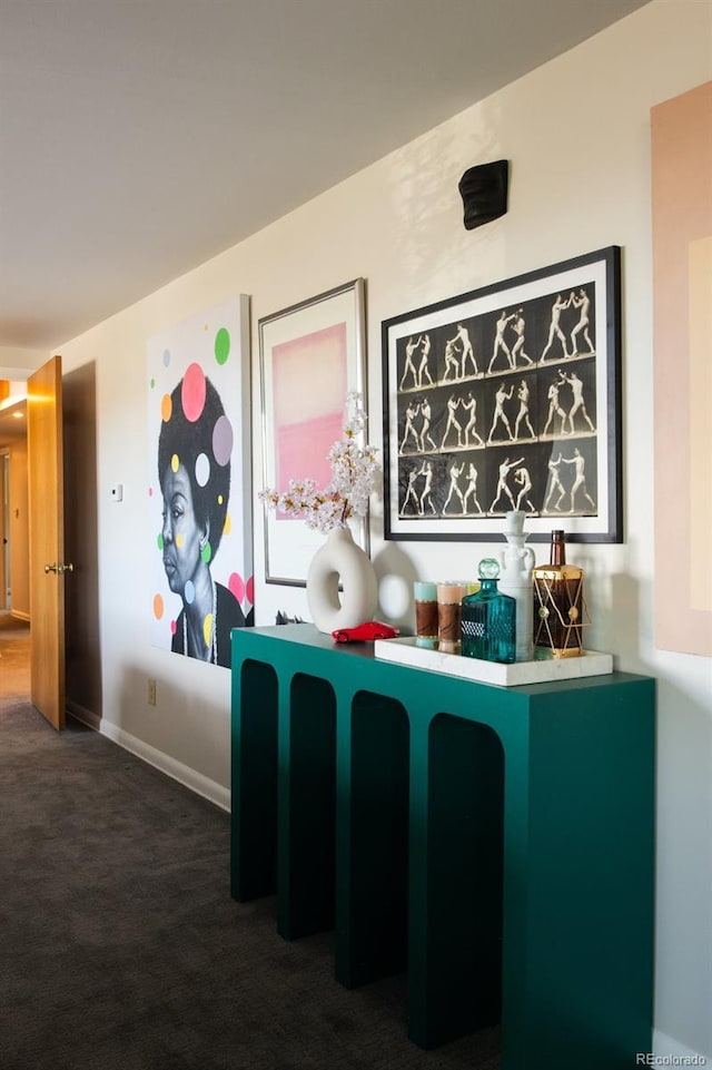 bar featuring baseboards and carpet flooring