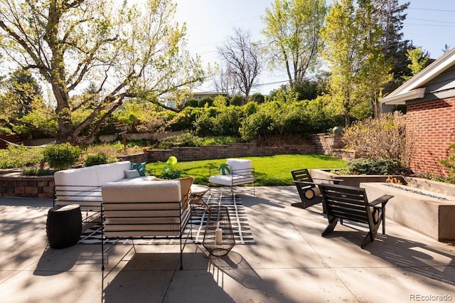 view of patio / terrace featuring an outdoor living space with a fire pit