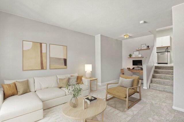 4574 S Cimmarron Cir Unit B, Aurora, CO 80015 - living area with light colored carpet, stairs, and a desk