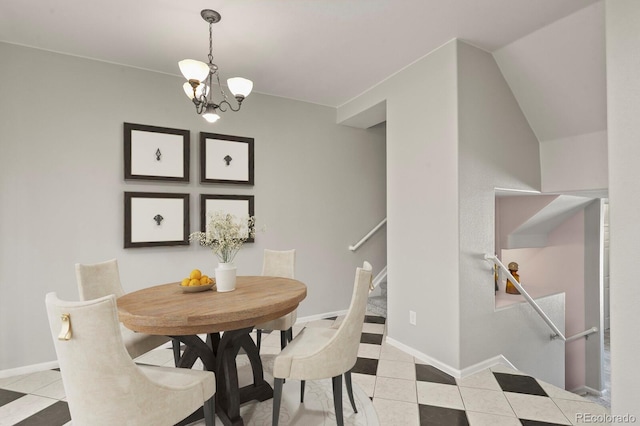 4574 S Cimmarron Cir Unit B, Aurora, CO 80015 - dining room with light tile patterned floors, a chandelier, and stairway