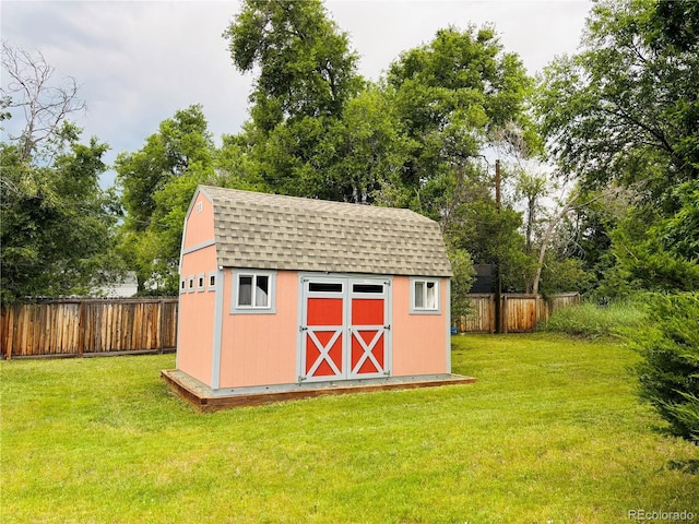 8211 Rocky Mountain Dr, Lakewood, CO 80214 - view of shed featuring a fenced backyard and view of wooded area