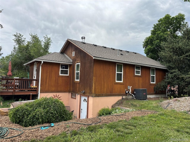 8211 Rocky Mountain Dr, Lakewood, CO 80214 - view of property exterior featuring roof with shingles and a deck