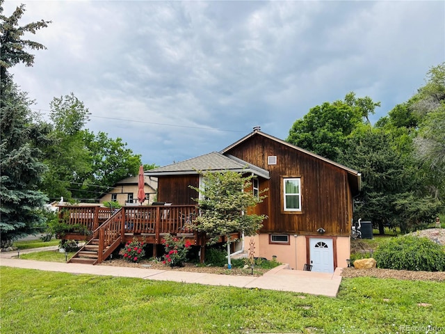 8211 Rocky Mountain Dr, Lakewood, CO 80214 - rear view of property with a deck and a lawn