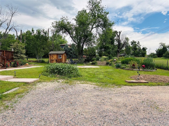 8211 Rocky Mountain Dr, Lakewood, CO 80214 - view of grassy yard with a storage unit