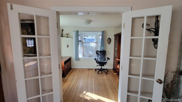 8211 Rocky Mountain Dr, Lakewood, CO 80214 - office space featuring light wood-style floors and french doors