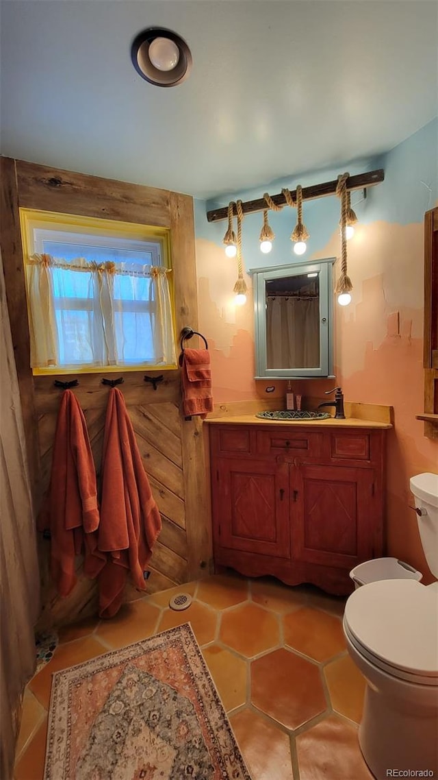 8211 Rocky Mountain Dr, Lakewood, CO 80214 - bathroom featuring vanity and tile patterned flooring