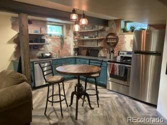 8211 Rocky Mountain Dr, Lakewood, CO 80214 - kitchen featuring stainless steel appliances, blue cabinets, and open shelves