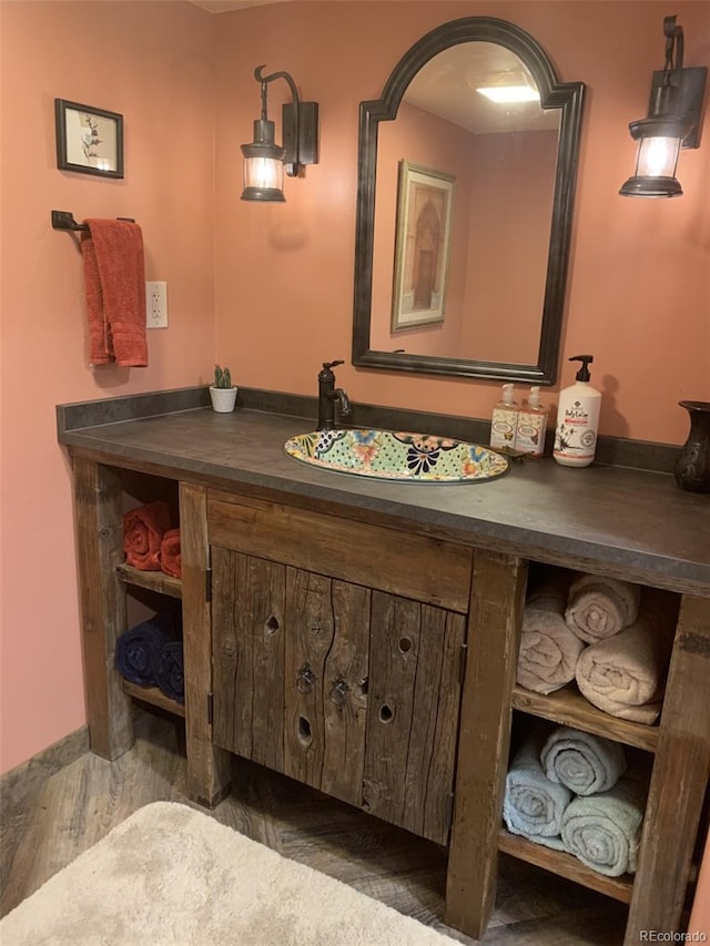8211 Rocky Mountain Dr, Lakewood, CO 80214 - bathroom with vanity and wood finished floors