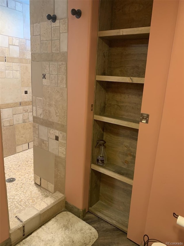 8211 Rocky Mountain Dr, Lakewood, CO 80214 - bathroom featuring tiled shower and toilet
