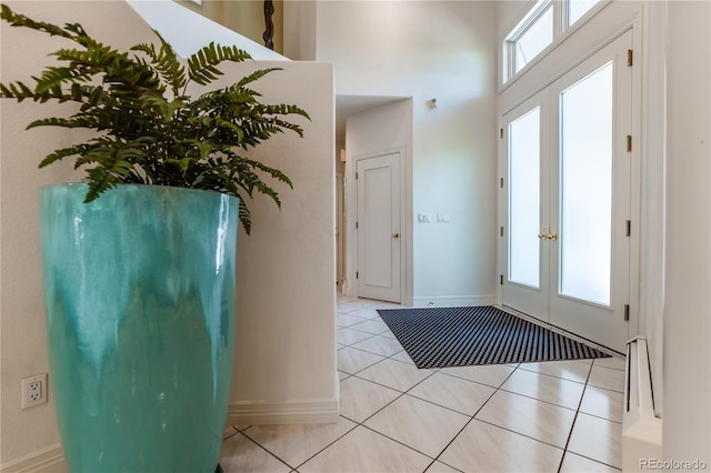 400 S Steele St Unit 13, Denver, CO 80209 - foyer entrance featuring light tile patterned floors, a high ceiling, and french doors