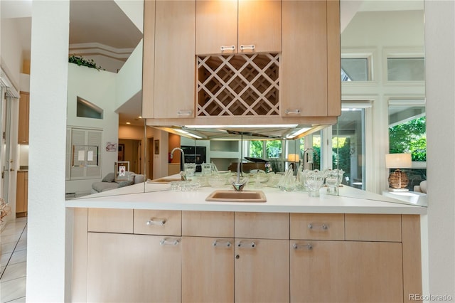 400 S Steele St Unit 13, Denver, CO 80209 - kitchen with light brown cabinets, light countertops, light tile patterned floors, and open floor plan