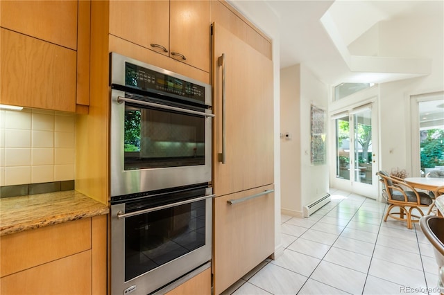 400 S Steele St Unit 13, Denver, CO 80209 - kitchen featuring double oven, a baseboard heating unit, high end fridge, decorative backsplash, and light stone counters