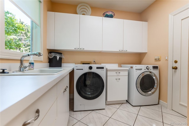 400 S Steele St Unit 13, Denver, CO 80209 - washroom with cabinet space, light tile patterned floors, and separate washer and dryer