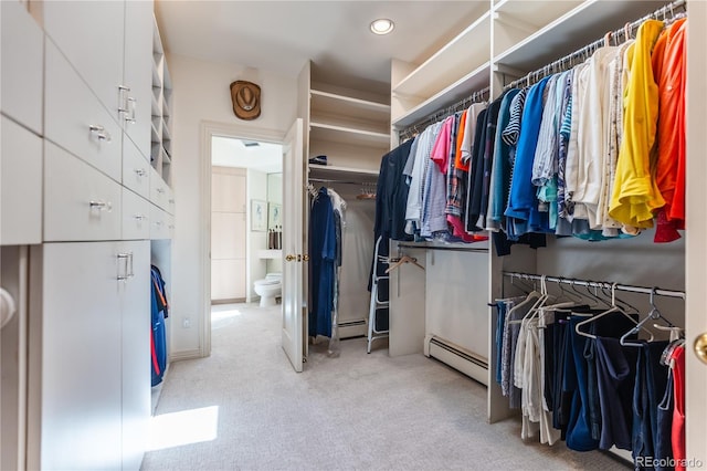 400 S Steele St Unit 13, Denver, CO 80209 - walk in closet featuring baseboard heating and carpet