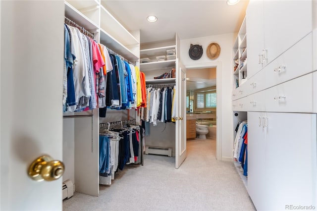 400 S Steele St Unit 13, Denver, CO 80209 - walk in closet with a baseboard heating unit and light colored carpet