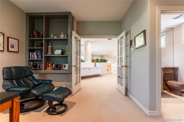 400 S Steele St Unit 13, Denver, CO 80209 - living area with french doors and carpet