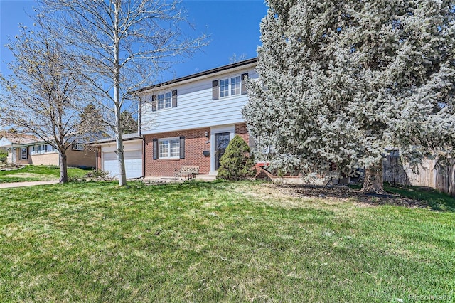 view of front of home featuring a garage and a front lawn