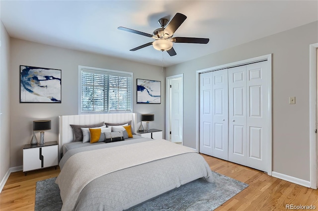 bedroom with ceiling fan, a closet, and light hardwood / wood-style floors