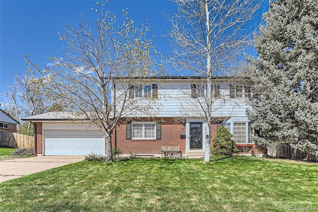 view of front of house with a front yard and a garage