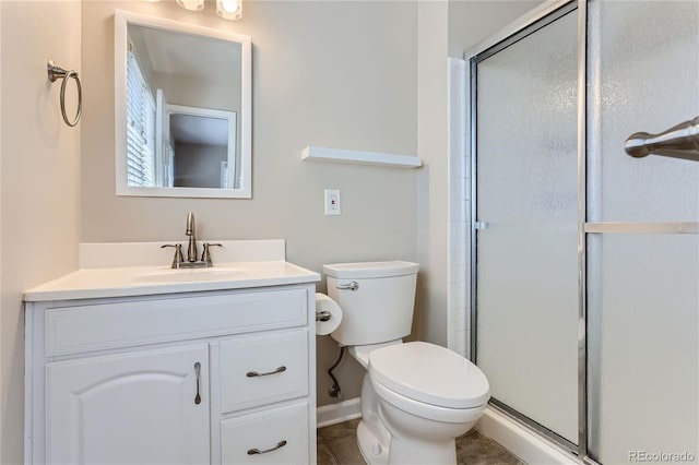 bathroom featuring tile patterned floors, an enclosed shower, vanity, and toilet