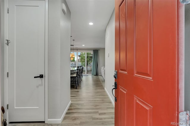 entrance foyer with baseboards, recessed lighting, and light wood-style flooring