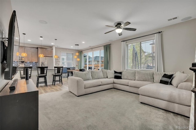 living area featuring visible vents, recessed lighting, light wood finished floors, and ceiling fan