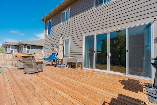 wooden deck featuring fence