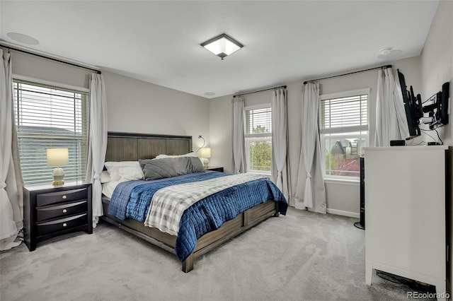 bedroom featuring baseboards and carpet flooring