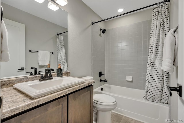 bathroom featuring vanity, shower / tub combo with curtain, wood finished floors, toilet, and recessed lighting