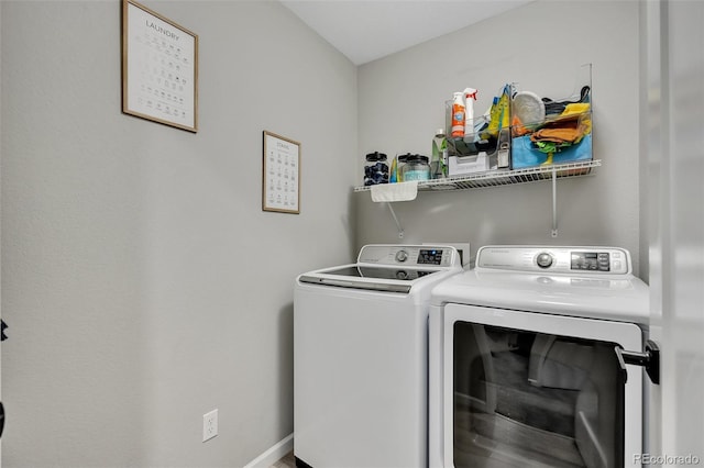 clothes washing area featuring laundry area and independent washer and dryer