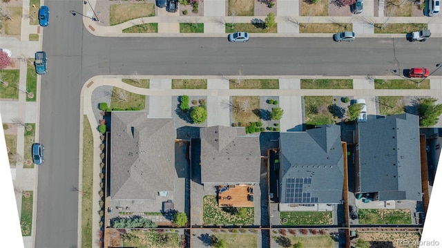 birds eye view of property with a residential view