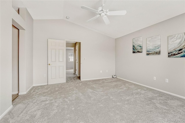 unfurnished bedroom with lofted ceiling, light colored carpet, and ceiling fan