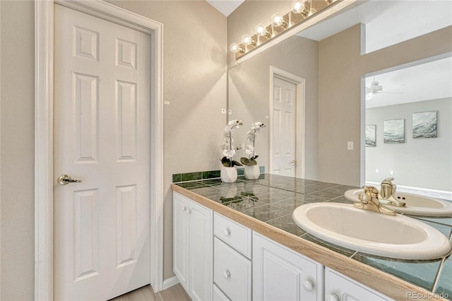 bathroom featuring vanity and ceiling fan