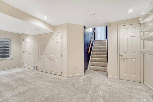 basement with light carpet