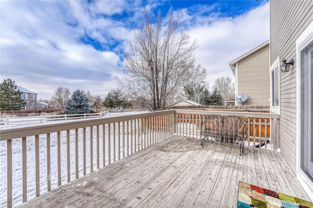 view of snow covered deck