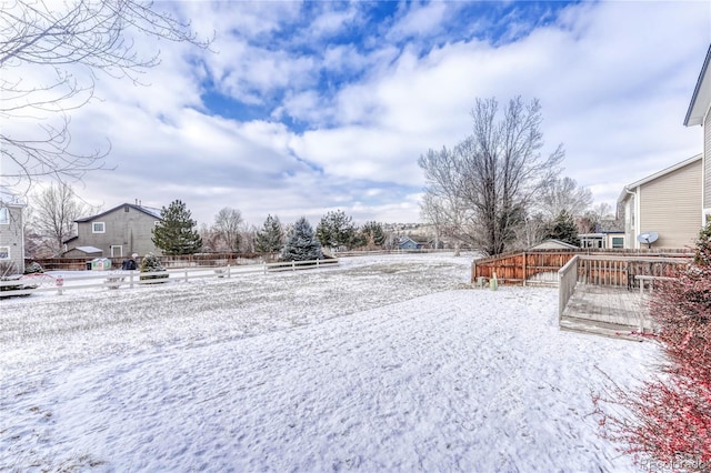 view of yard layered in snow