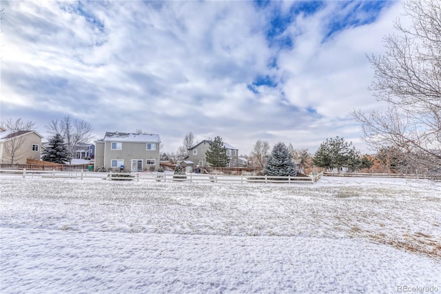 view of yard layered in snow