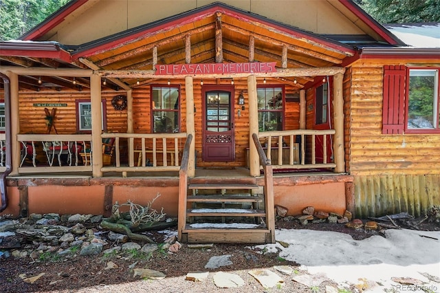 27802 Shadow Mountain Dr, Conifer, CO 80433 - doorway to property featuring a porch