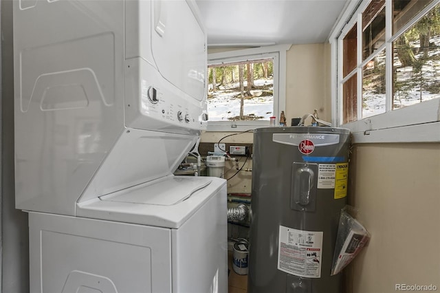 27802 Shadow Mountain Dr, Conifer, CO 80433 - laundry area with stacked washing machine and dryer and electric water heater