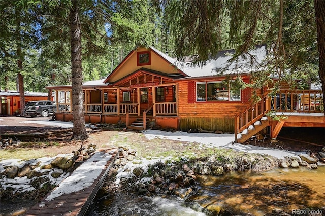 27802 Shadow Mountain Dr, Conifer, CO 80433 - view of front of house featuring a wooden deck and stairway