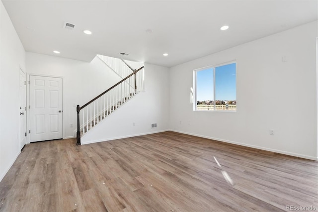 unfurnished living room with light hardwood / wood-style floors