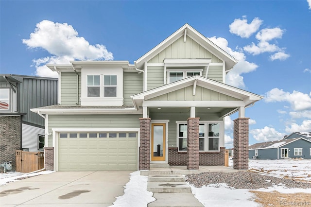 craftsman-style house featuring a garage and covered porch