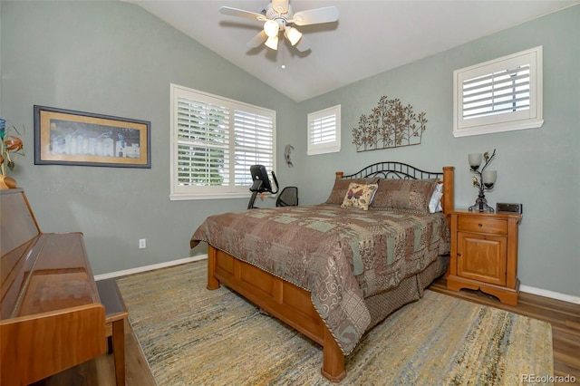 bedroom featuring ceiling fan, hardwood / wood-style flooring, and lofted ceiling