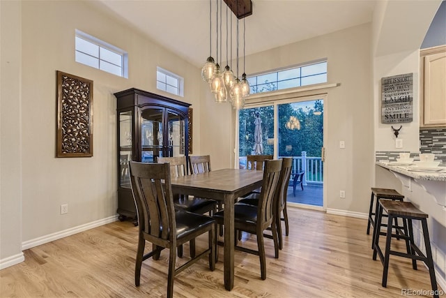 3120 Redhaven Way, Highlands Ranch, CO 80126 - dining area with baseboards, plenty of natural light, and light wood-style floors