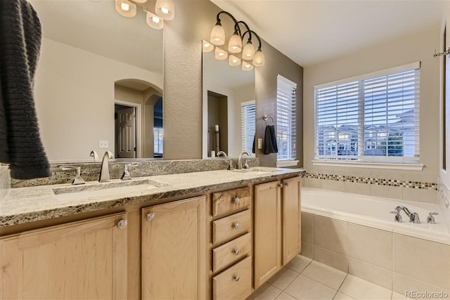 3120 Redhaven Way, Highlands Ranch, CO 80126 - bathroom with double vanity, a sink, tile patterned flooring, and a garden tub
