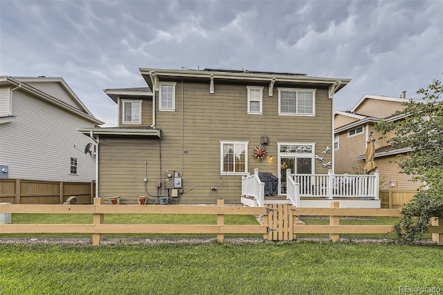 3120 Redhaven Way, Highlands Ranch, CO 80126 - back of property featuring a lawn, fence private yard, and a deck