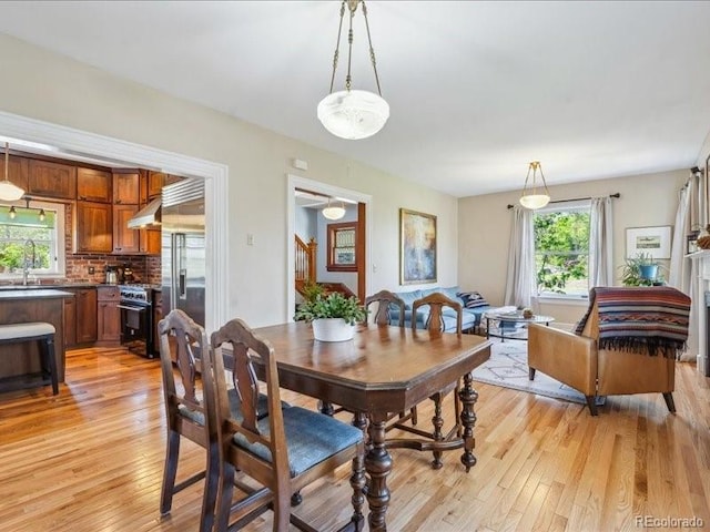 dining area with light wood-style floors