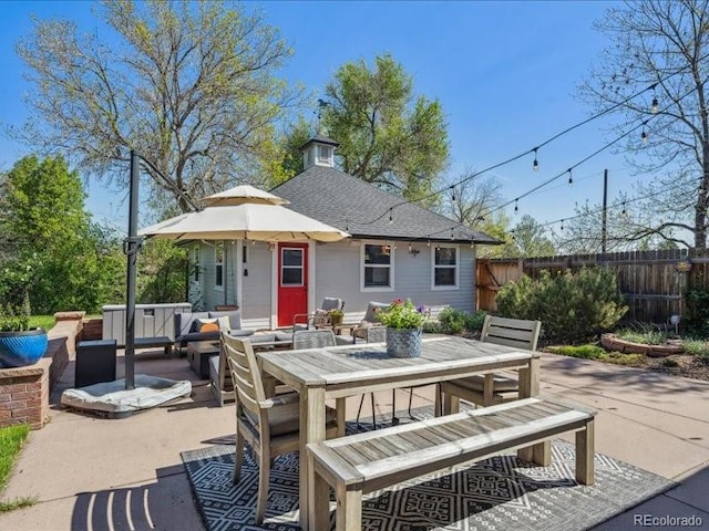 view of patio / terrace with fence, outdoor dining space, and outdoor lounge area