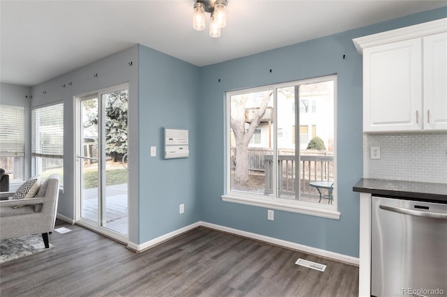 dining area with dark hardwood / wood-style flooring