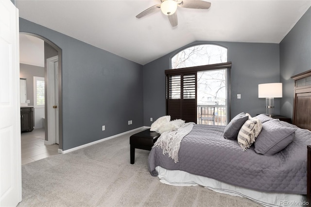 carpeted bedroom with access to exterior, ceiling fan, and lofted ceiling